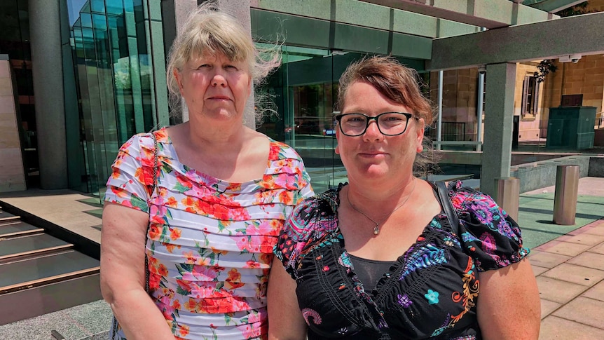 Two women outside SA coroners court.