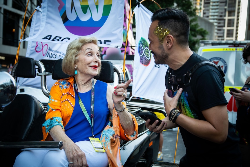 Jason Om at the 2023 Mardi Gras parade in the ABC float with Ita Buttrose.