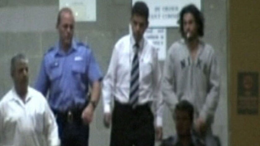 Convicted murderer Cameron James Russell (right)