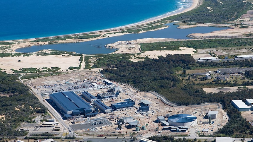 An aerial shot of a large industrial plant near the coast