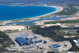 An aerial shot of a large industrial plant near the coast