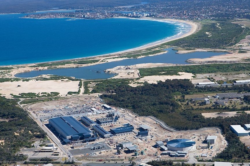 An aerial shot of a large industrial plant near the coast