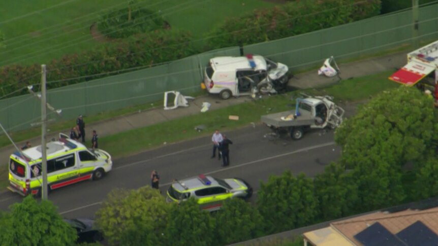 Aerial of authorities at the scene of a critical head-on car smash