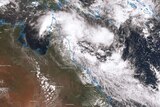 A satellite image of the Queensland Coast with clouds showing the early stages of a possible cyclone.