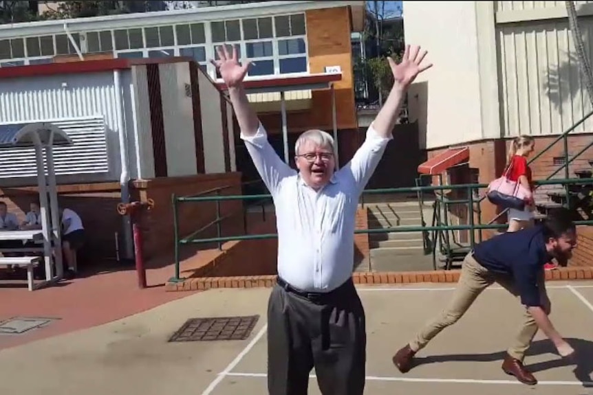 Kevin Rudd wins one of the handball games in Brisbane.