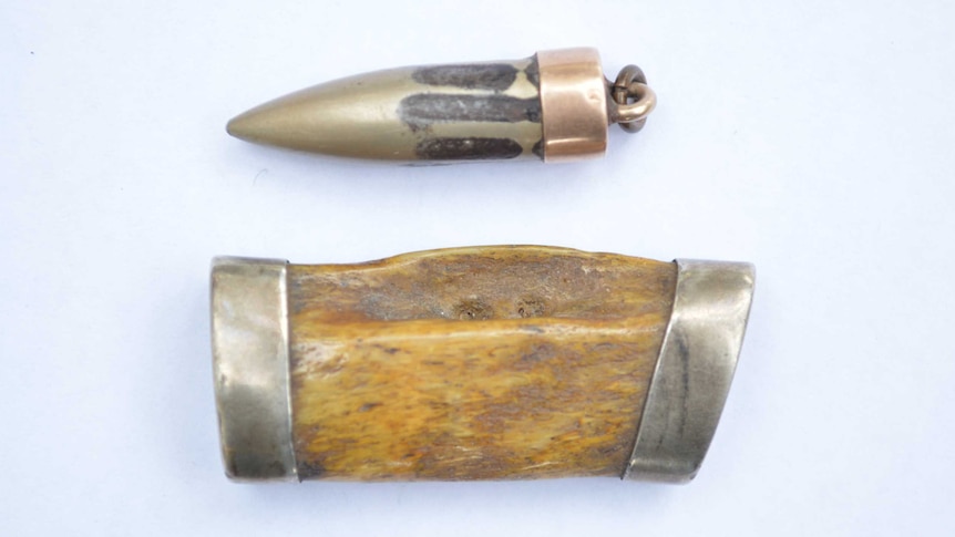 A WWI bullet and a piece of Bill Rudd's rib bone, which was struck by the bullet.