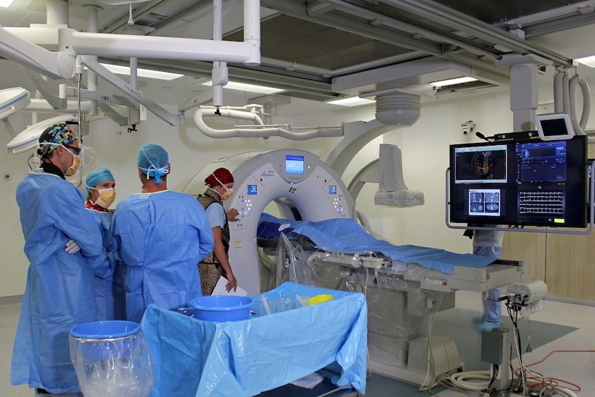 Medical staff use the angio-CT hybrid theatre has been unveiled at the Sunshine Coast University Hospital in Queensland