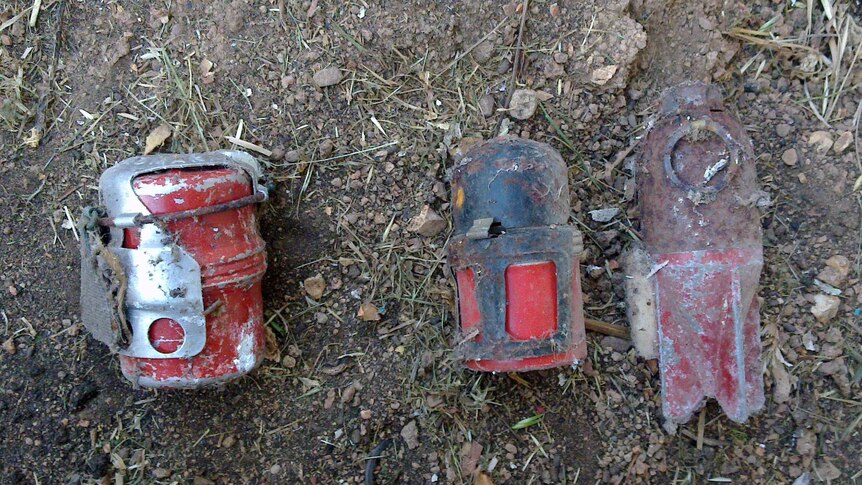 The two hand grenades and round of mortar were found in a rusted tin under the house.