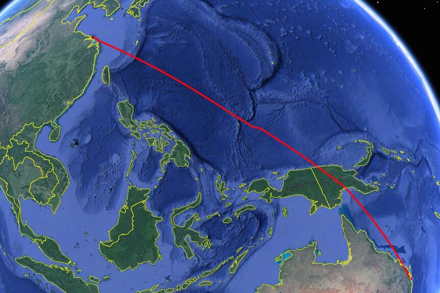 Map of earth with flight path line from Australian to China.