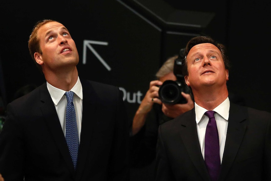 Prince William (L) and David Cameron have been named in FIFA's corruption report into World Cup bids.