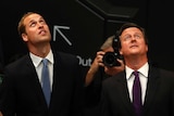 Prince William (L) and David Cameron have been named in FIFA's corruption report into World Cup bids.