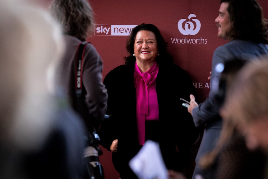 Gina Rinehart smiling and chatting to reporters at the Bush Summit in Perth.