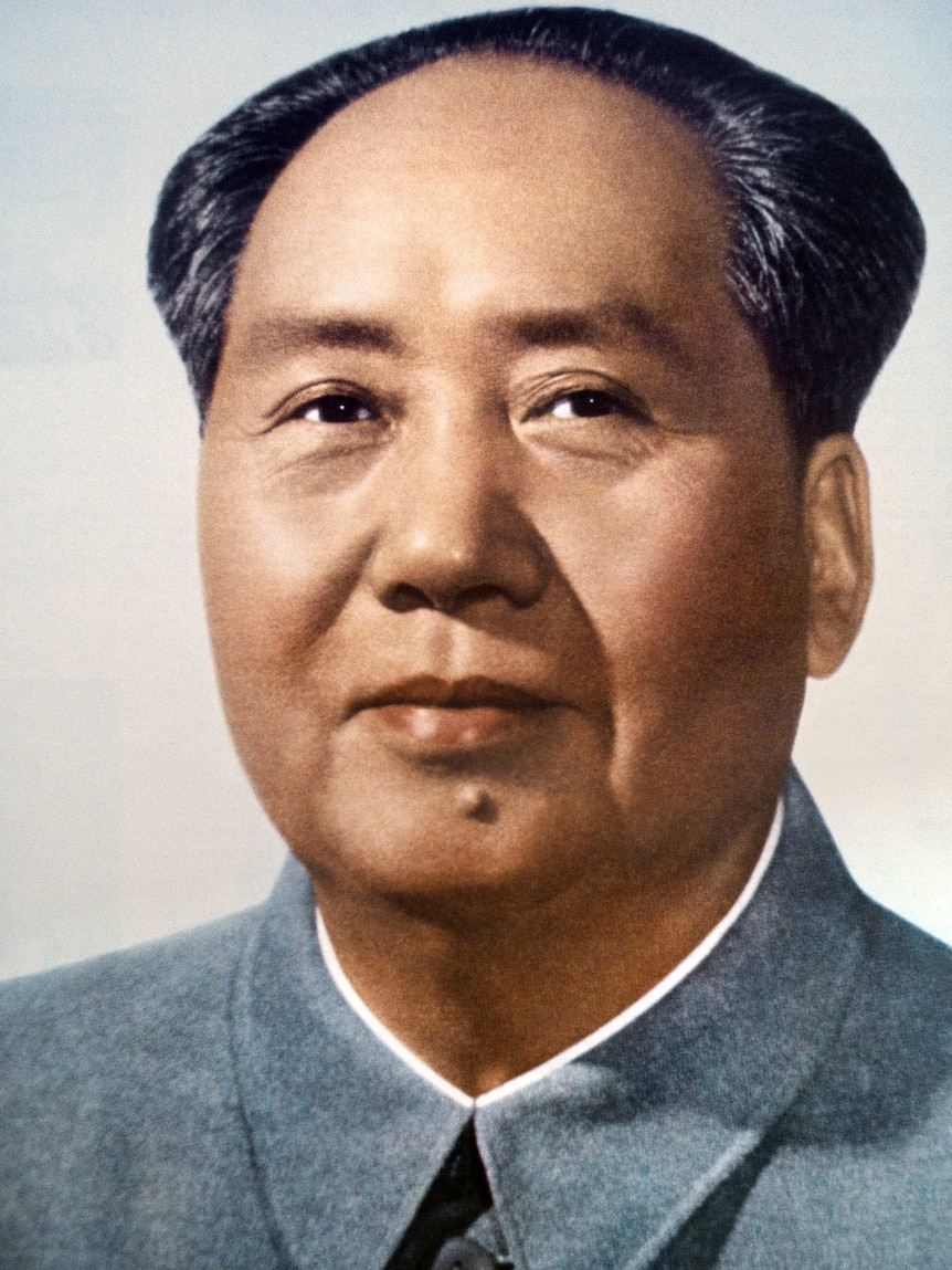 Headshot of Mao Zedong in grey overcoat.