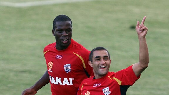 Hindmarsh homecoming ... Djite (l) was a fan favourite in his time with Adelaide United. (file photo)