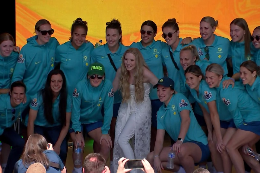 The Matildas huddle around Nikki Webster