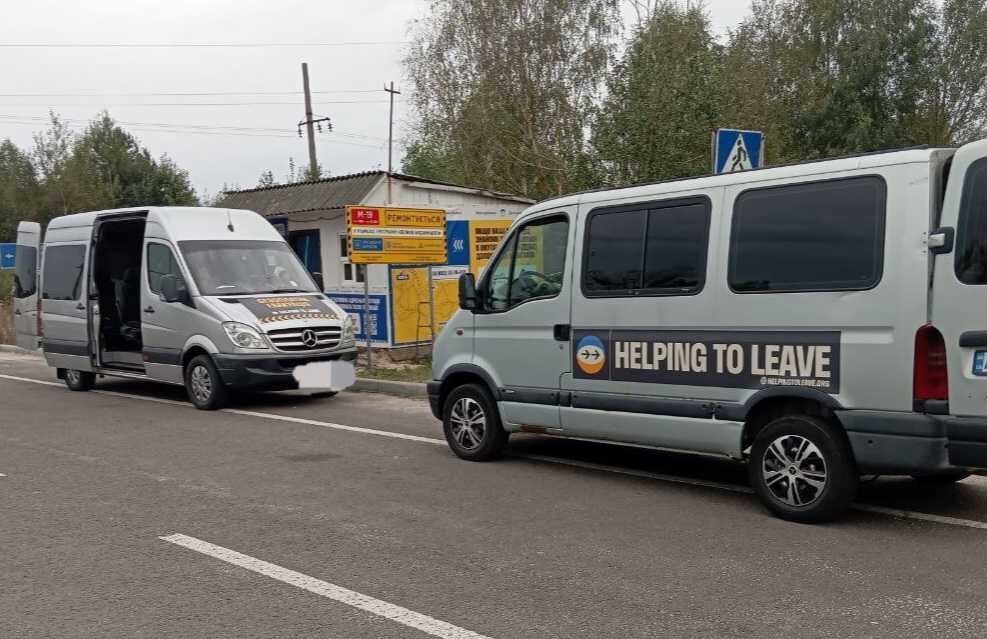 Helping to Leave vans on the side of the road at an evacuation checkpoint. 