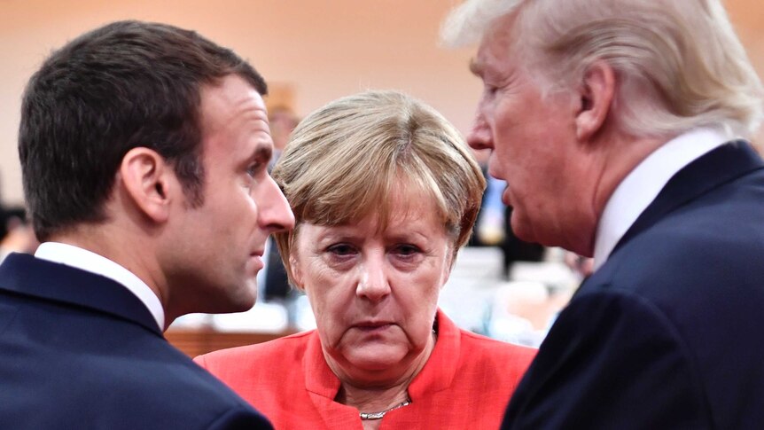 French President Emmanuel Macron (left), German Chancellor Angela Merkel (middle) and US President Donald Trump (Right) speak