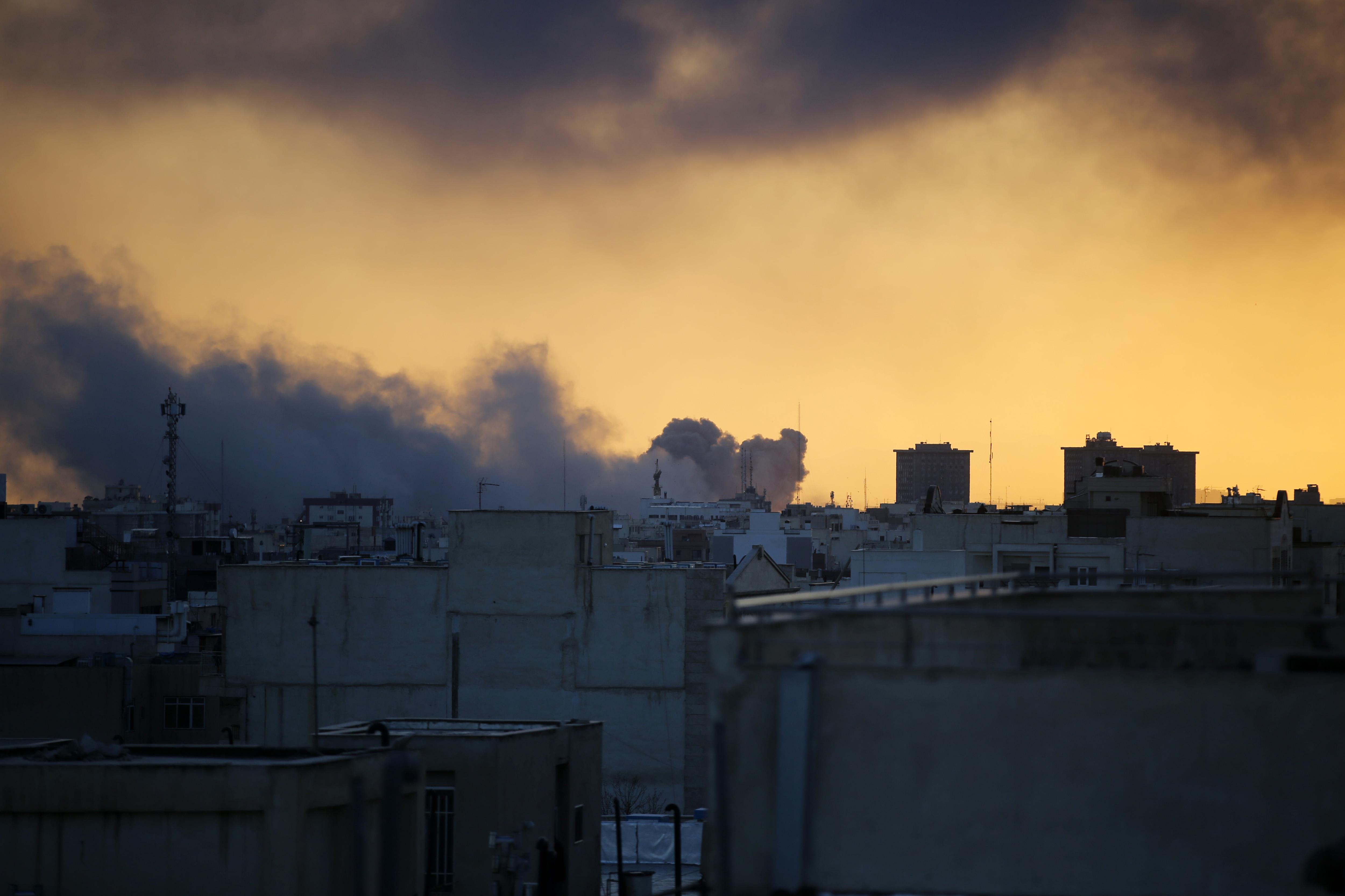Thick smoke rises over western areas of Tehran following continued US and Israeli strikes