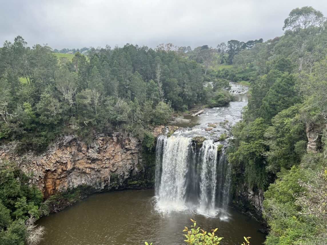 Water falls down 30 metres from a creek into a large swimming pool