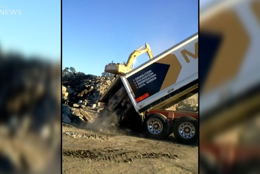 Truck dumping rubble