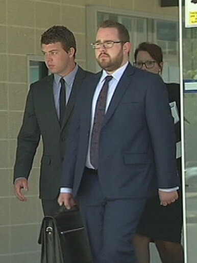 Logan Dunlop and lawyer Peter Woodhouse leave the ACT Magistrates Court.