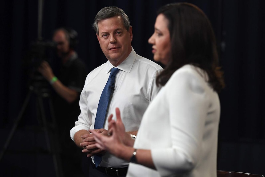 Tim Nicholls listens as Annastacia Palaszczuk speaks