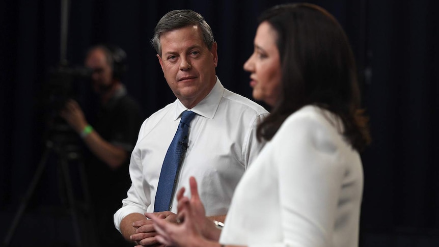 Tim Nicholls listens as Annastacia Palaszczuk speaks