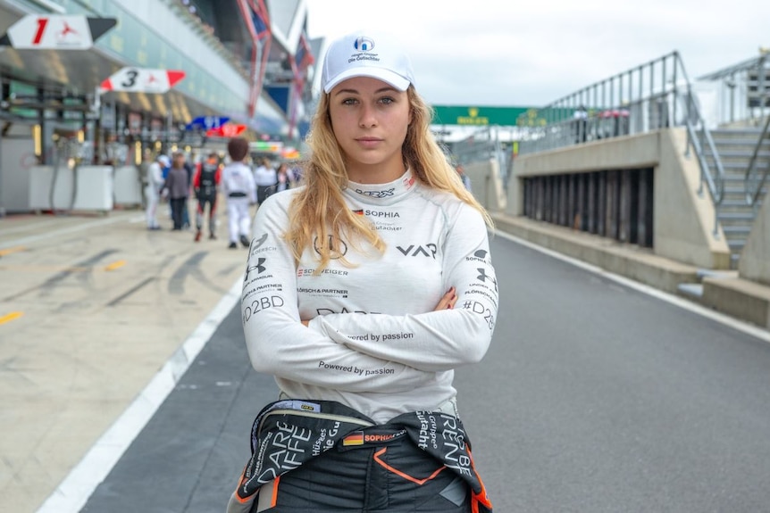 A young woman with blonde hair and a look of determination.