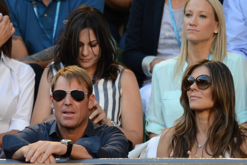 Warne and Hurley watch on