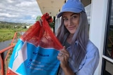 Leonie Starr and a bag of bottles.