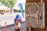A child on the main street of Tennant Creek.