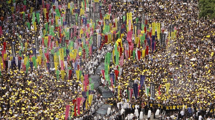 Colourful procession: 15,000 mourners lined the Seoul streets.