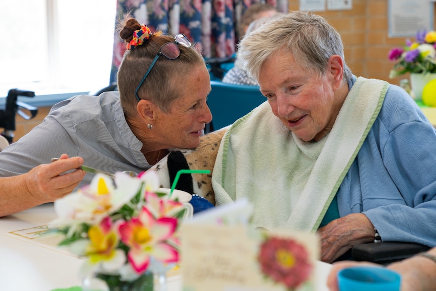 Registered nurse Penny Abbington feeds an aged care resident