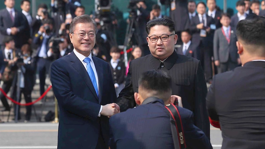 North Korean leader Kim Jong-un (right) poses with South Korean President Moon Jae-in.