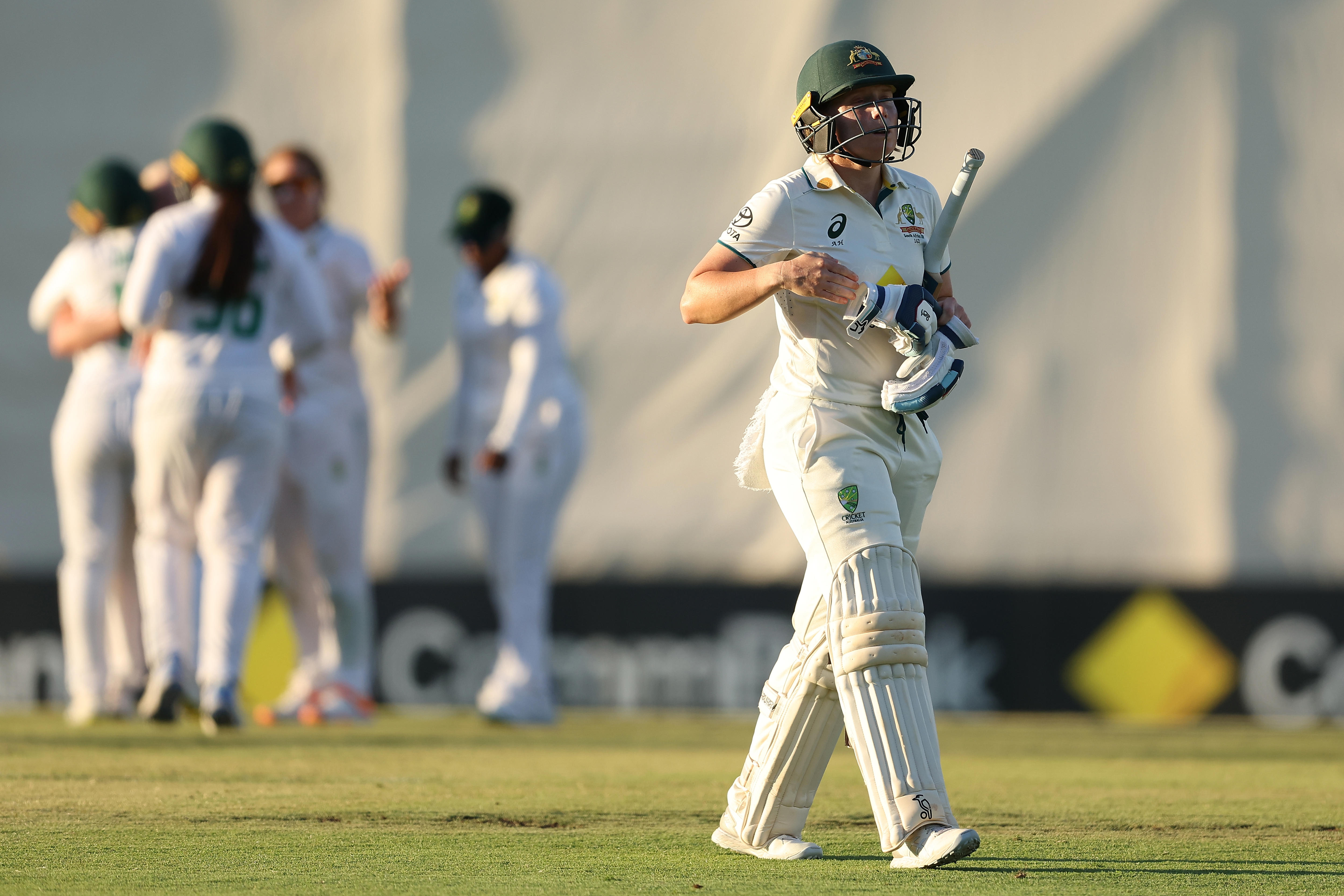 Australia batter Alyssa Healy walks off the field after being dismissed in a Test against South Africa.