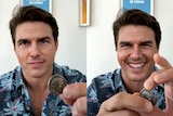 A deepfake image of Tom Cruise doing a coin trick.