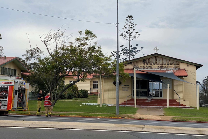 Fire fighters mop up after a 60-year-old church was burnt down in Bundaberg.
