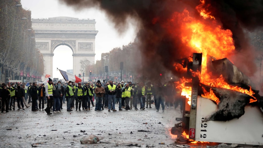 A truck burns during a "yellow vest" protest on the Champs-Elysees in Paris.