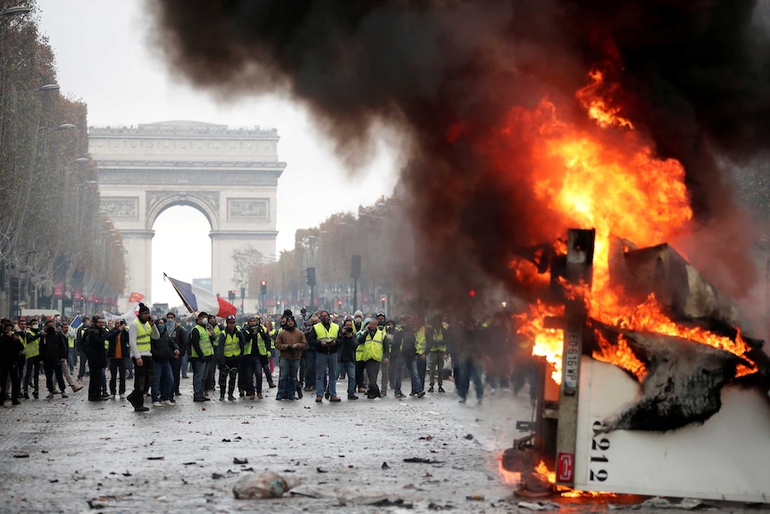A truck burns during a "yellow vest" protest on the Champs-Elysees in Paris.