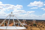 Five telescopes sit on red earth in the Murchison pointing at the sky as ESCAP/SKA bid underway