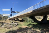 A concrete walkway crossing a dry riverbed in Alice Springs.