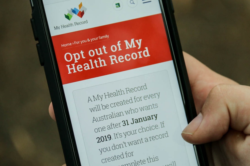 A mobile phone shows the My Health Record opt out screen