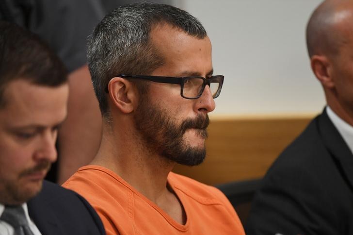 Christopher Watts looks to the front bench with a steely expression during sentencing for several counts of first-degree murder