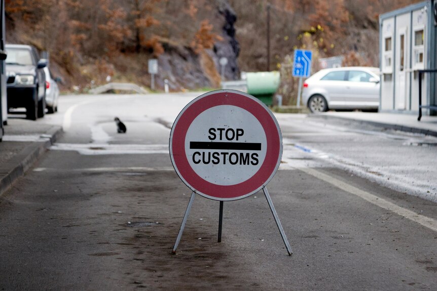 'Stop customs' sign seen at border of Kosovo-Serbia.