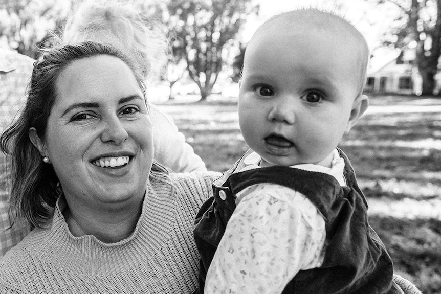 A black and white photo of a woman and her daugther