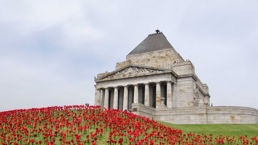 Crocheted poppies in front of Melbourne War Memorial