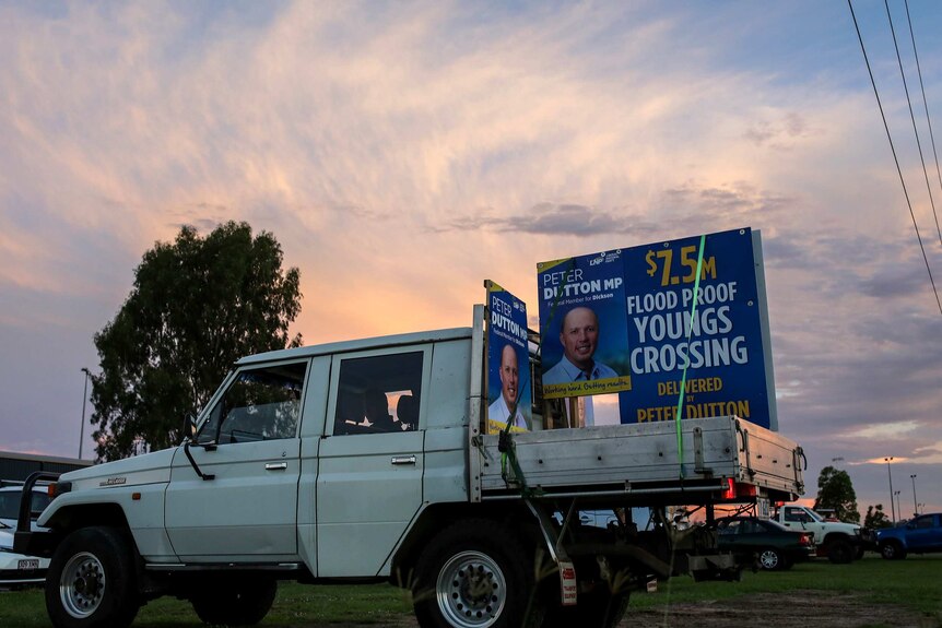 A ute with Peter Dutton corflutes on it sits at a junior rugby game in Albany Creek.