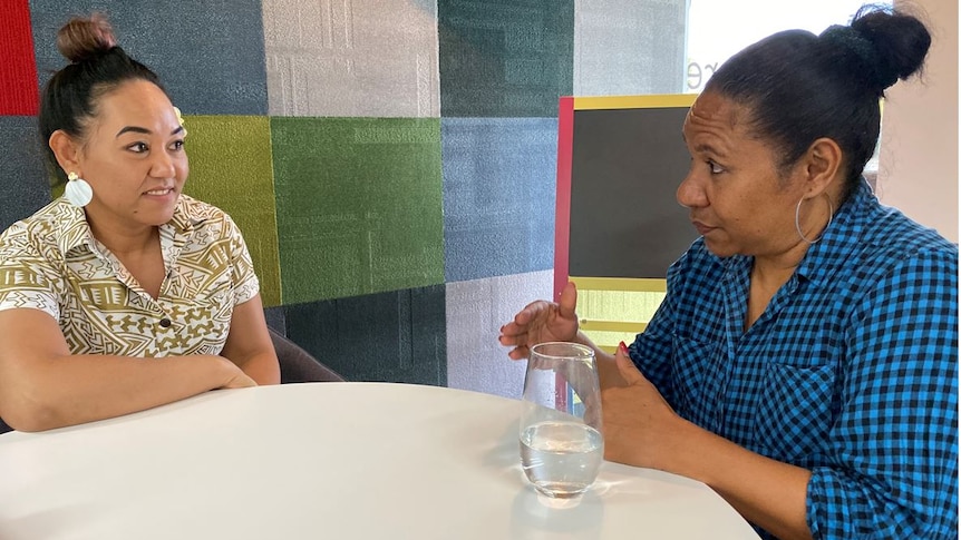 YFS employment mentor Vanessa Niuewenhuizen talks to Anne Korre from PNG in the YFS office in Logan.