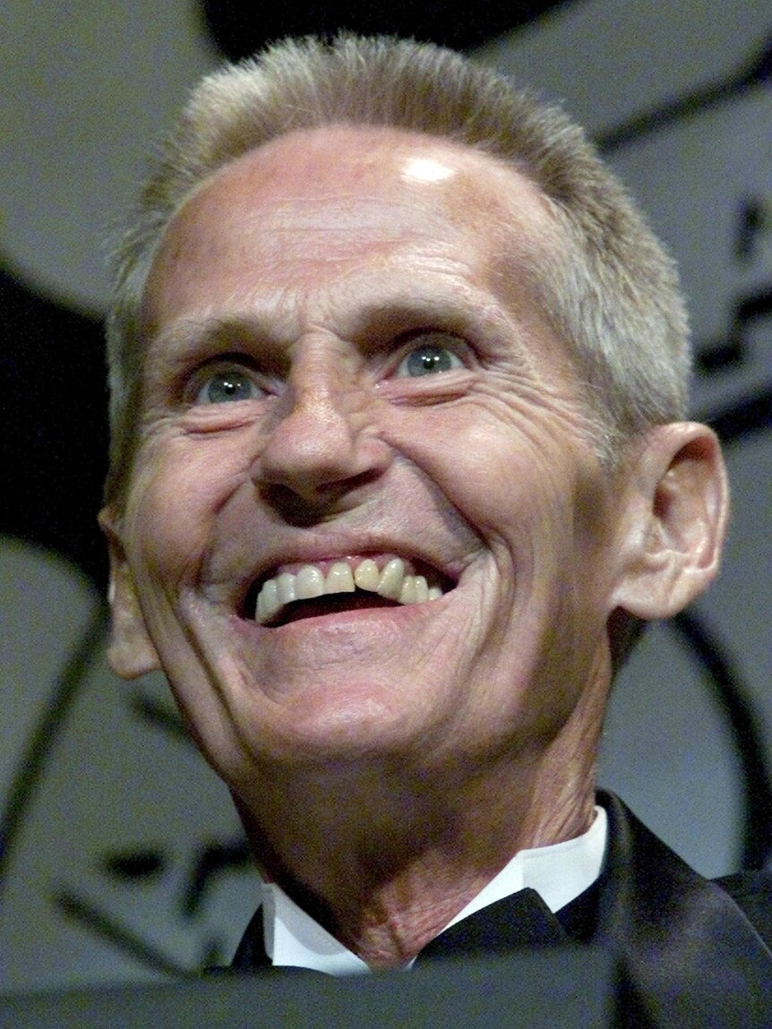 Levon Helm smiles onstage at an awards show in 2001.