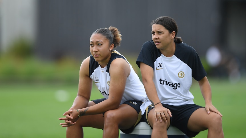 Lauren James and Sam Kerr sit together during a Chelsea training session